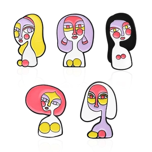 Set of 5 abstract enamel pins with Picasso style colorful artistic faces on white background
