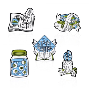 Set of 5 enamel pins featuring graduation books, candles, and notes with soft blue tones