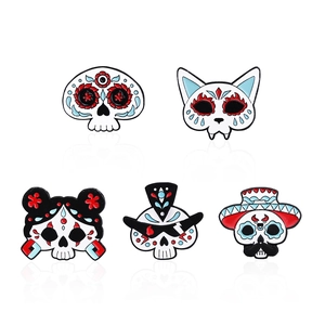 5-piece Day of the Dead enamel pin set featuring colorful skull face designs