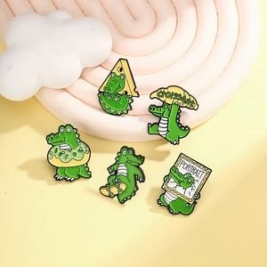 5-piece set of green enamel crocodile pins featuring croissants and skateboards