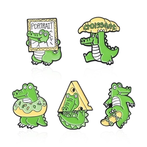 5-piece set of cartoon crocodile enamel pins featuring croissant and skateboard designs