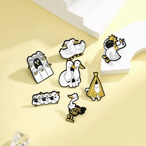 Creative cartoon enamel pin set featuring unique white duck and cat designs on white steps