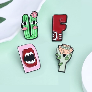 Cartoon enamel lapel pins set featuring alphabet monsters and creative desert plants