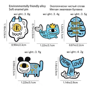 Cartoon enamel lapel pins set featuring cute one-eyed monsters and blue animals