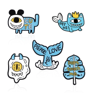 5-piece cartoon one-eyed monster enamel pin set with blue and white animal designs