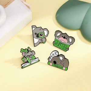 Adorable set of four koala enamel pins in various poses for bags and jackets