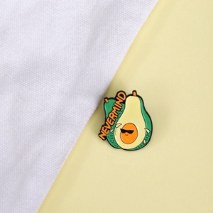 Cute cartoon avocado enamel pin with sunglasses and Nevermind text on a stylish background