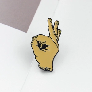 Unique OK hand gesture enamel pin with creative finger design for fashion accessories