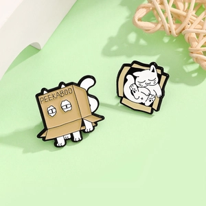 Cute enamel cat pins featuring white cats hiding in peekaboo cardboard boxes