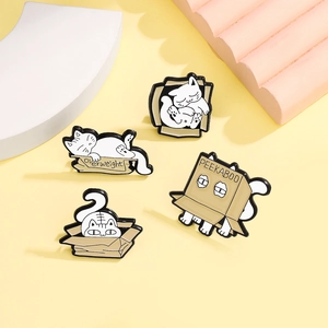 Set of four fat cat enamel pins featuring naughty cats hiding in cardboard boxes