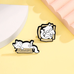 Set of two cute fat white cat enamel pins featuring a flattened cardboard box design