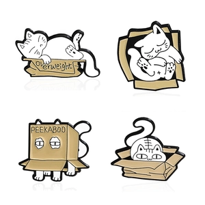 Set of four cute white cat enamel pins with cardboard boxes featuring PEEKABOO text