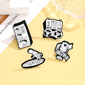 Set of 4 music-themed enamel pins featuring a retro microphone and a speaker with tongue