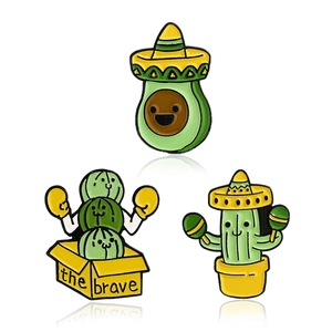 Funny avocado and boxing cactus enamel pins set with bold colors on a white background