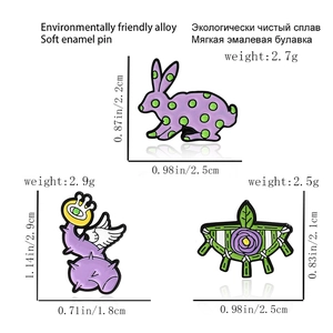 Detailed size chart of cute purple rabbit and eye-shaped enamel pins with measurements