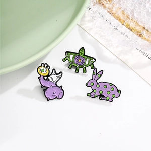 Three-piece cartoon alloy enamel pins featuring a rabbit and floral surrealist designs