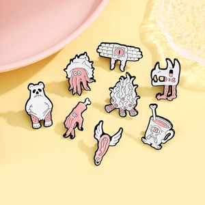 Set of 8 surrealist enamel pins featuring winged ears and eye palms on yellow background