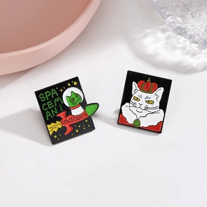 Space-themed cat enamel pins set featuring an astronaut cat on a rocket and a royal cat king