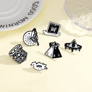 Creative black and white enamel brooch set featuring butterfly and geometric designs