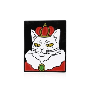Artistic enamel brooch featuring a crowned white cat in a red cape with gold accents