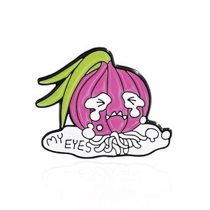 Close-up of a crying onion enamel pin featuring MY EYES text and vibrant purple colors