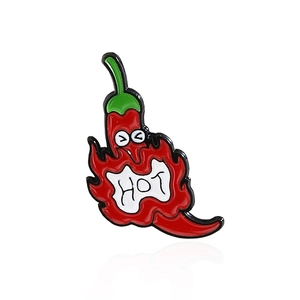 Creative red chili enamel pin with funny face and hot text on a white background