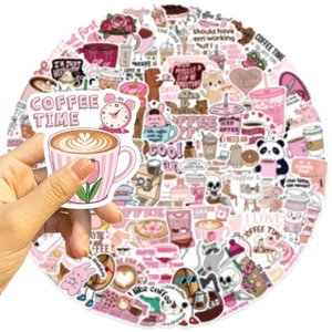 Close-up of pink coffee time waterproof sticker on a guitar and laptop surface