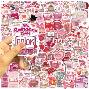 Close-up of pink bookish Valentine stickers with It's Romance Time and Book Lover quotes