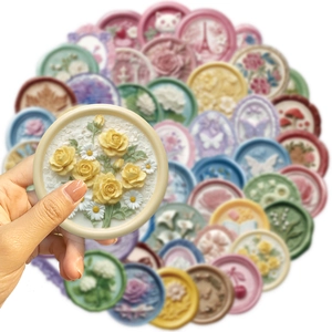 Close-up of 3D embossed PET transparent stickers with floral and cat motifs for journals