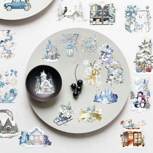 Detailed view of waterproof PET winter watercolor stickers with snowy house and snowman
