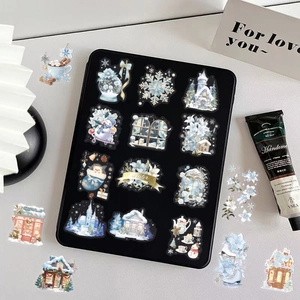 Waterproof winter watercolor stickers with snowflakes and snowmen on a tablet case