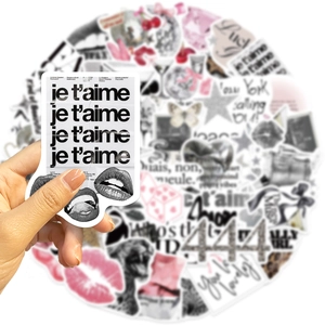 Close-up of French retro Lucky Girl vinyl stickers with butterfly and heart patterns