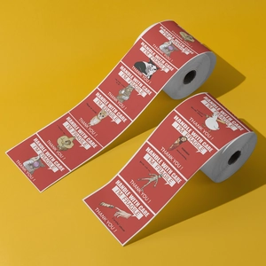 Detailed view of red fragile meme stickers in a roll for shipping and safe handling