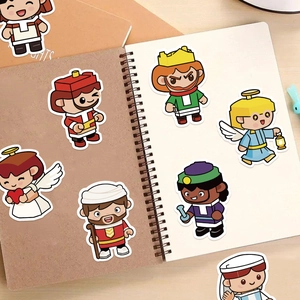 Detail of cartoon angel PVC stickers on a notebook featuring colorful religious figures