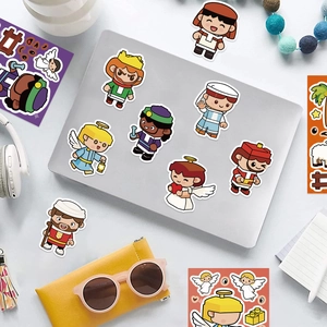 DIY colorful cartoon angel character stickers decorating a laptop surface with accessories