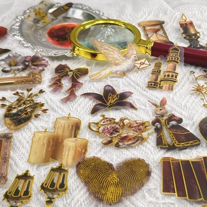 Detail of vintage palace style PET stickers featuring gold edges on lace background