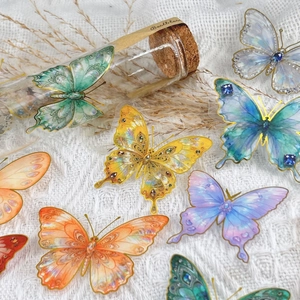 Vibrant translucent PET butterfly stickers with gold foil details and holographic finish
