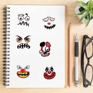 Halloween stickers on a notebook featuring spooky zombie and clown character illustrations