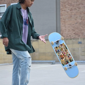 Artistic classical painting stickers applied to a skateboard during an outdoor stunt