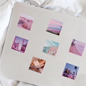 Detail of square aesthetic photography stickers with palm trees on silver laptop case
