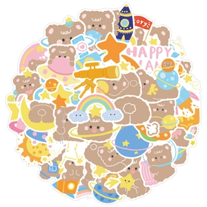 Close-up of cute cartoon space bear stickers with rocket and planet illustrations