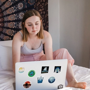 Waterproof climate change stickers with Global Warming slogans on a laptop lid