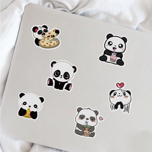 Close-up of cute cartoon panda stickers showing bubble tea and pizza on a laptop