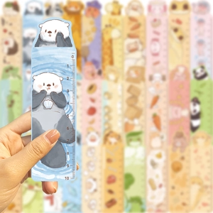 Close-up of a blue sea otter cartoon animal ruler bookmark with 10cm scale markings
