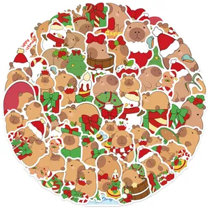 Close-up of waterproof Christmas Capybara stickers featuring festive hats and trees