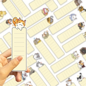 Close-up of cute cartoon cat paper bookmarks with lined space for notes and reading