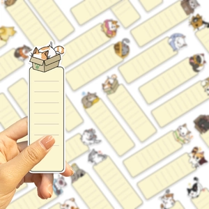 Detail of cartoon cat bookmark featuring a calico cat illustration and lined writing space