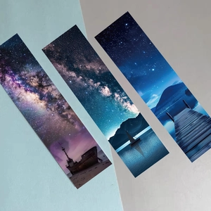 Three starry night sky bookmarks with celestial landscapes and cosmic scenery on blue base