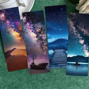 Set of four starry galaxy bookmarks featuring desert night and coastal boat scenery