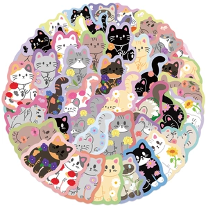 Close-up of waterproof cartoon cat stickers with floral accents for luggage and journals